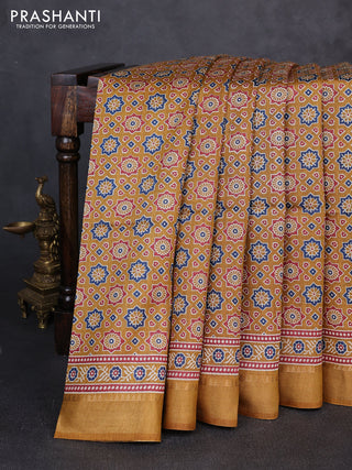 Munga tussar silk saree mustard yellow with allover ajrakh prints and zari woven border
