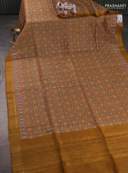 Munga tussar silk saree mustard yellow with allover ajrakh prints and zari woven border