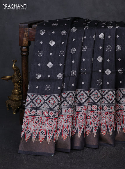Munga tussar silk saree black with allover butta prints and ajrakh printed pallu