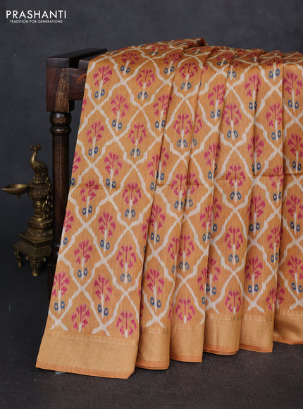 Munga tussar silk saree mustard yellow with allover ikat prints and zari woven border