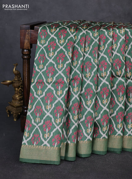 Munga tussar silk saree green with allover ikat prints and zari woven border