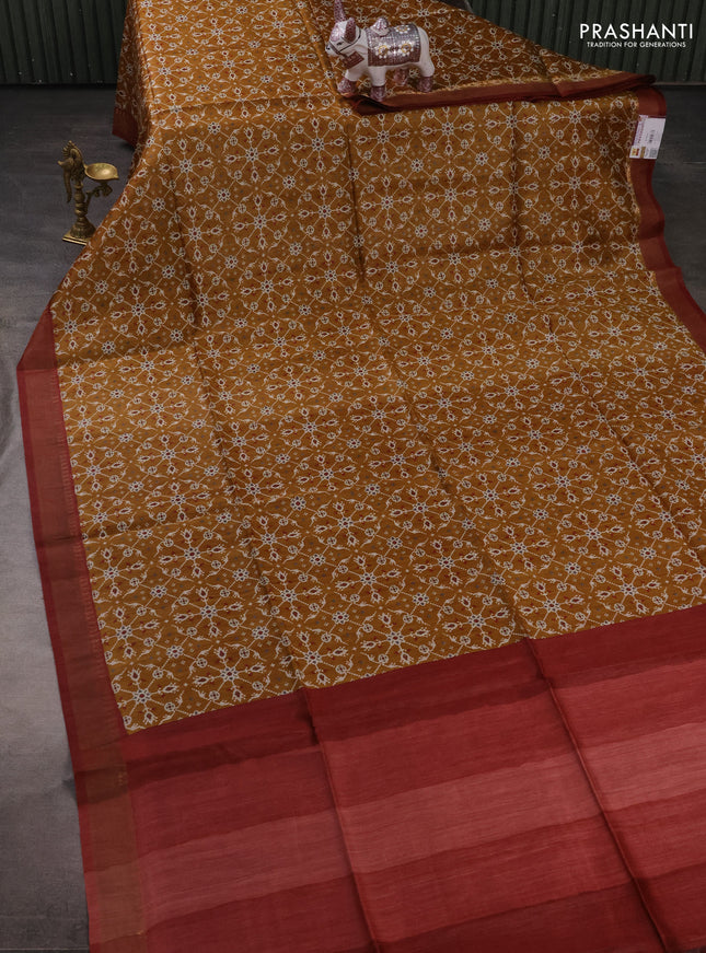 Munga tussar silk saree maroon and dark mustard with allover ikat prints and zari woven border