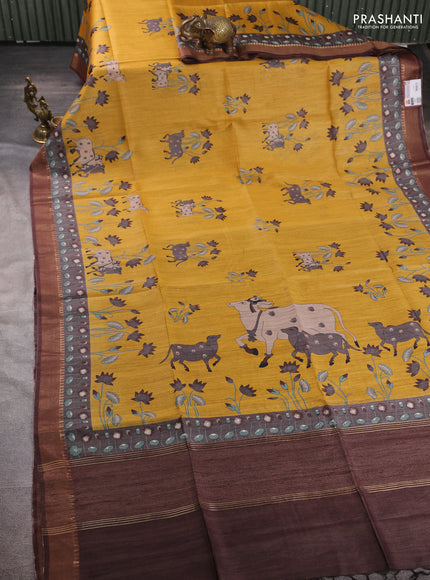 Munga tussar silk saree mustard yellow and coffee brown with allover pichwai prints and zari woven border