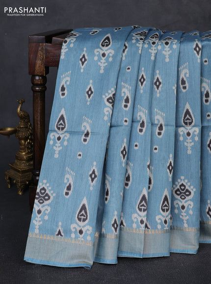 Munga tussar silk saree pastel blue with allover ikat prints and zari woven border