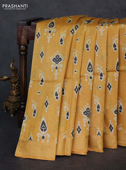 Munga tussar silk saree mustard yellow with allover ikat prints and zari woven border