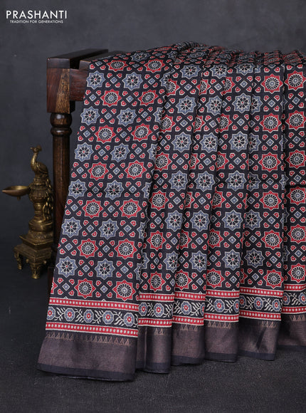 Munga tussar silk saree black with allover ajrakh prints and zari woven border