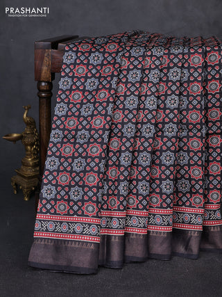 Munga tussar silk saree black with allover ajrakh prints and zari woven border