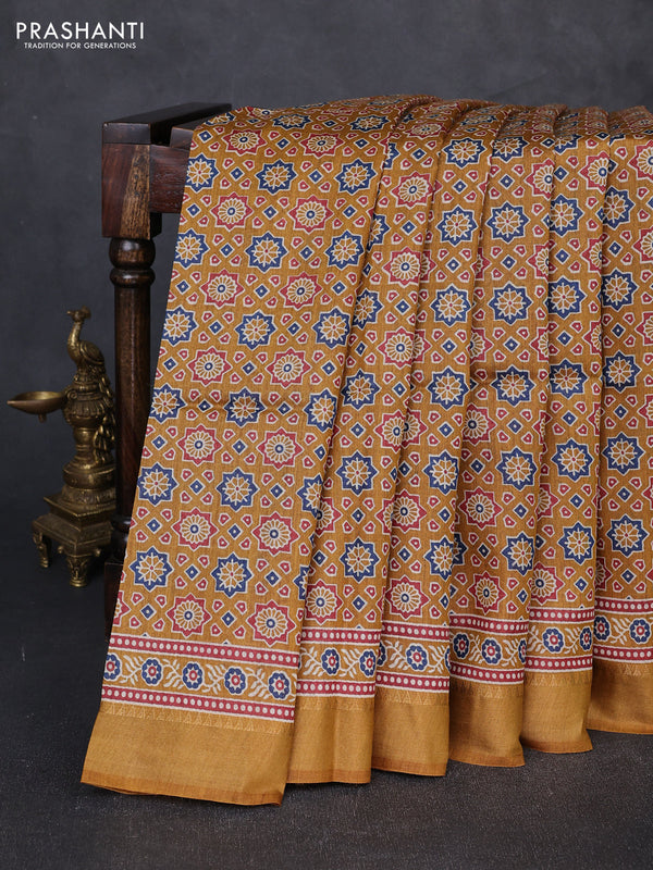 Munga tussar silk saree dark mustard with allover ajrakh prints and zari woven border