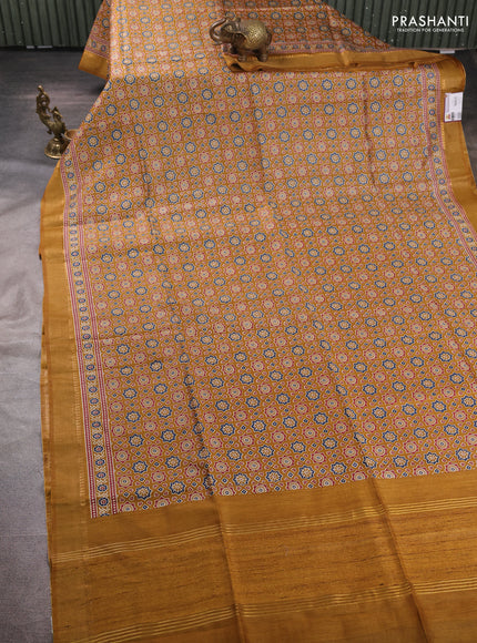 Munga tussar silk saree dark mustard with allover ajrakh prints and zari woven border
