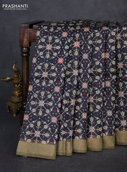 Munga tussar silk saree black and mehendi green with allover ikat prints and zari woven border