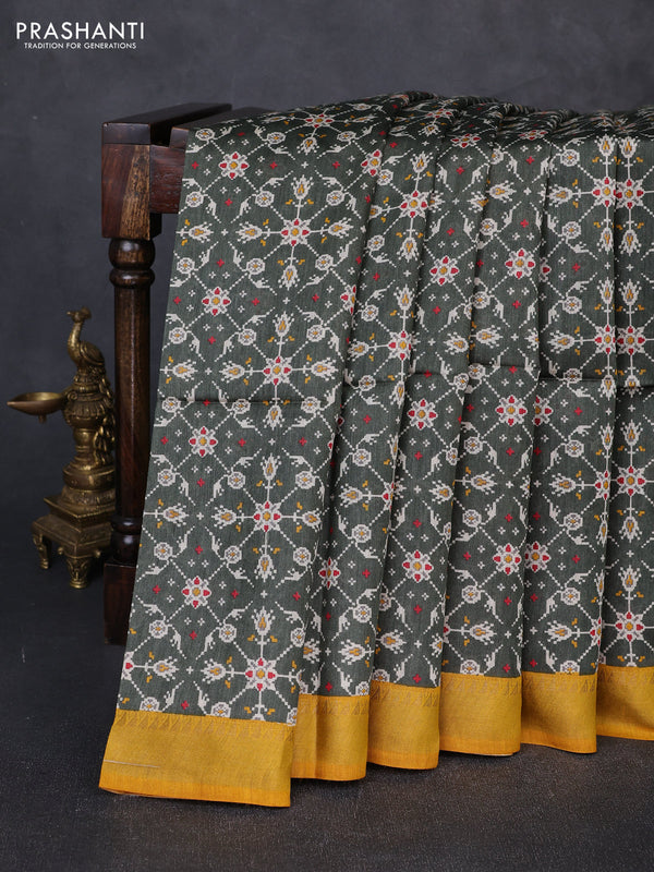 Munga tussar silk saree deep sap green and mustard yellow with allover ikat prints and zari woven border