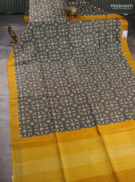 Munga tussar silk saree deep sap green and mustard yellow with allover ikat prints and zari woven border
