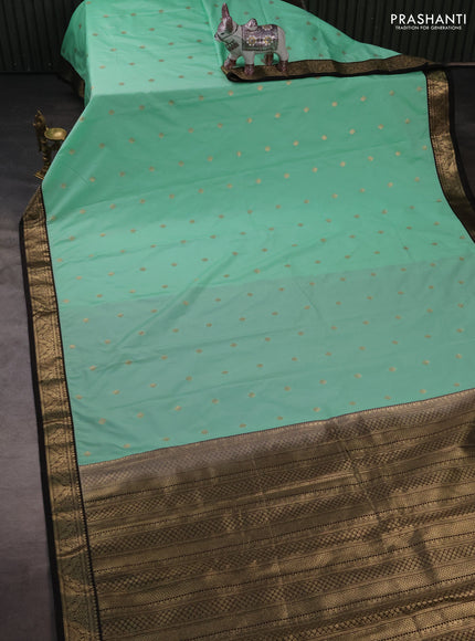 Semi kanchipuram silk saree teal green and coffee brown with zari woven buttas and small zari woven border