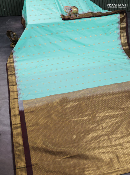 Semi kanchipuram silk saree teal green and coffee brown with allover zari woven buttas and temple design zari woven border