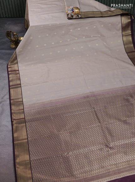 Semi kanchipuram silk saree beige and deep purple with allover zari weaves & buttas and zari woven border