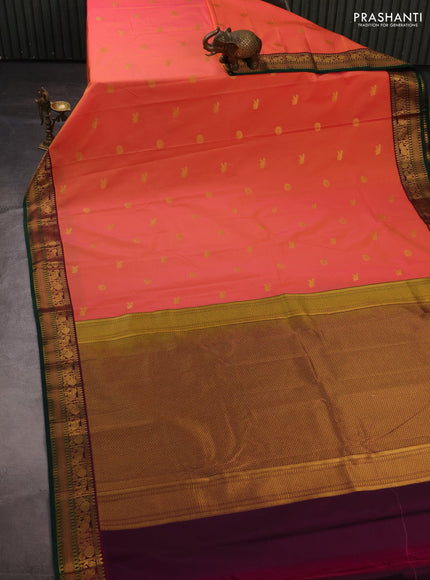 Semi kanchipuram silk saree dual shade of pinkish orange and purple with zari woven buttas and temple design zari woven border