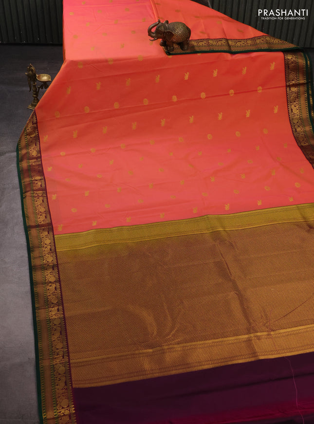 Semi kanchipuram silk saree dual shade of pinkish orange and purple with zari woven buttas and temple design zari woven border