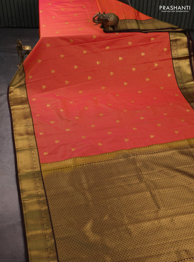 Semi kanchipuram silk saree dual shade of pinkish orange and coffee brown with allover small zari checks & buttas and zari woven korvai border