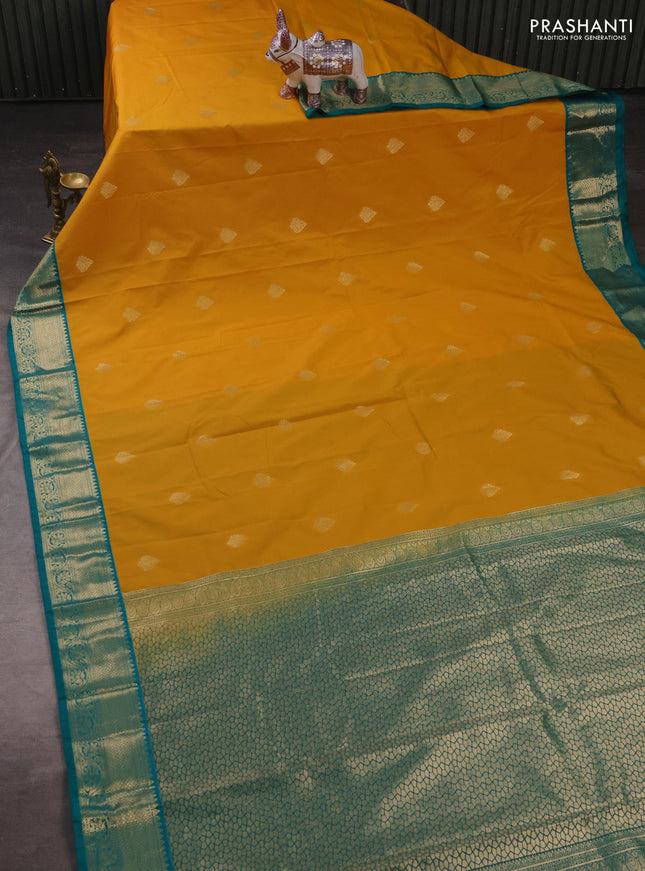 Semi kanchipuram silk saree mustard yellow and teal green with zari woven buttas and zari woven korvai border