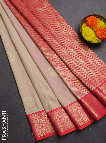 Semi kanchipuram silk saree cream and dual shade pinkish orange with paisley zari woven buttas and zari woven korvai border