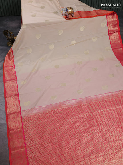Semi kanchipuram silk saree cream and dual shade pinkish orange with paisley zari woven buttas and zari woven korvai border