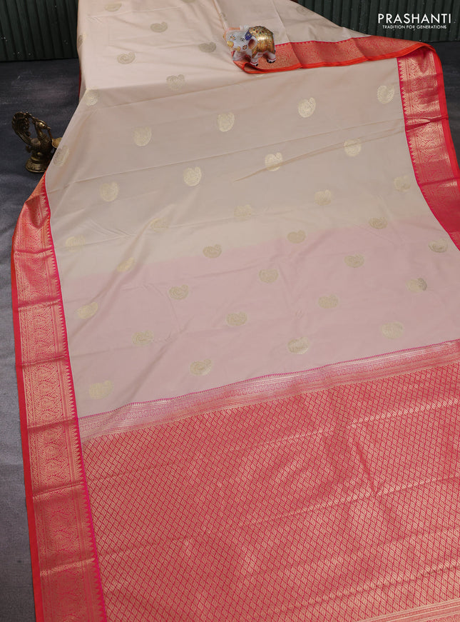 Semi kanchipuram silk saree cream and dual shade pinkish orange with paisley zari woven buttas and zari woven korvai border