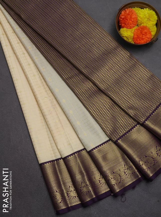 Semi kanchipuram silk saree beige and deep purple with allover zari checks & buttas and temple design zari woven border