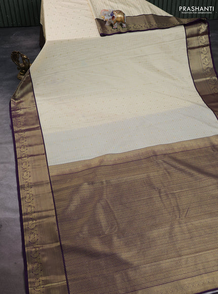 Semi kanchipuram silk saree beige and deep purple with allover zari checks & buttas and temple design zari woven border