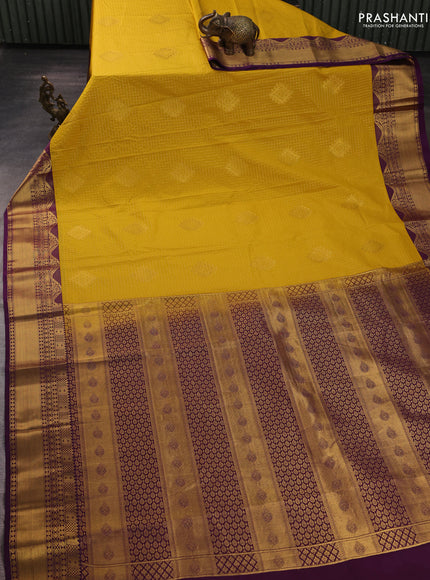 Semi kanchipuram silk saree yellow and purple with allover zari checks & buttas and zari woven border