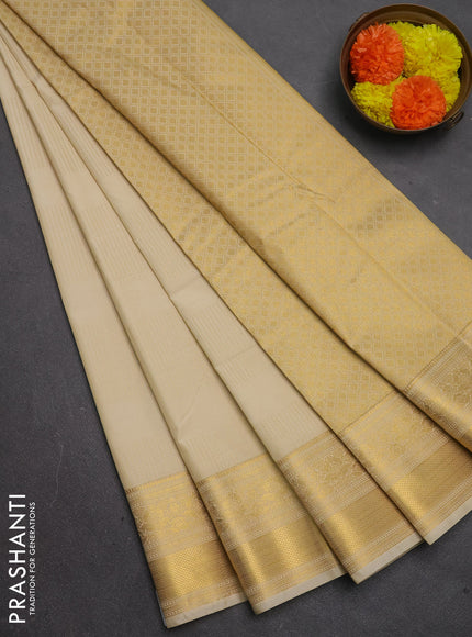 Semi kanchipuram silk saree beige with allover zari weaves & buttas and zari woven border