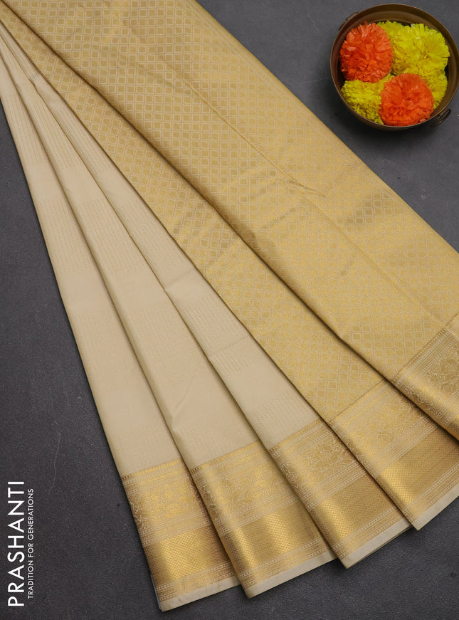 Semi kanchipuram silk saree beige with allover zari weaves & buttas and zari woven border