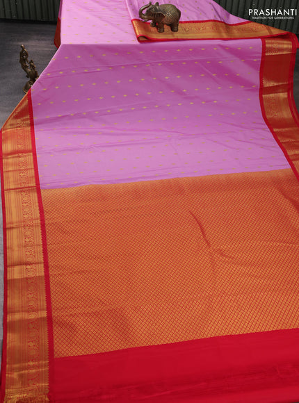 Semi kanchipuram silk saree lotus pink and red with allover zari woven buttas and temple design zari woven border