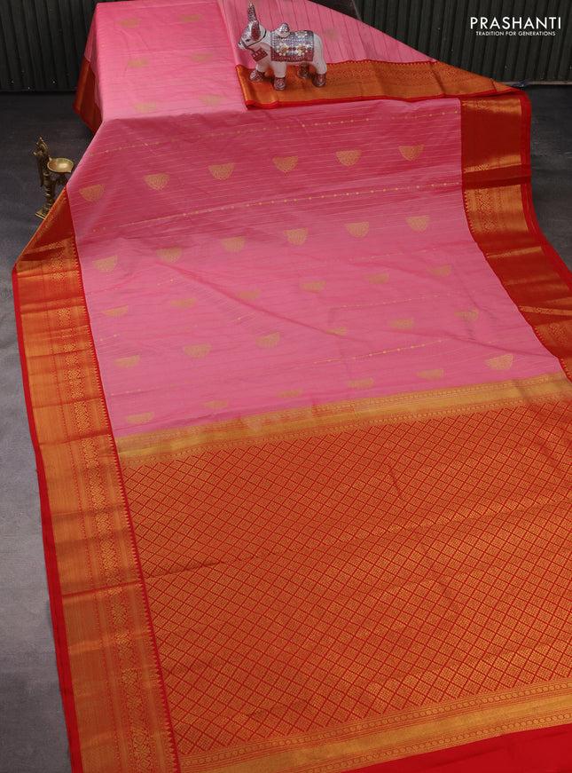 Semi kanchipuram silk saree peach pink and red with allover zari stripes & buttas and temple design zari woven border