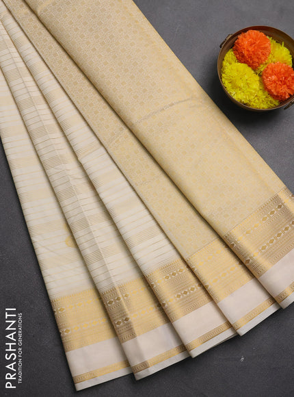 Semi kanchipuram silk saree cream with allover zari weaves & buttas and zari woven border