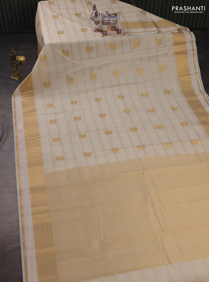 Semi kanchipuram silk saree cream with allover zari weaves & buttas and zari woven border