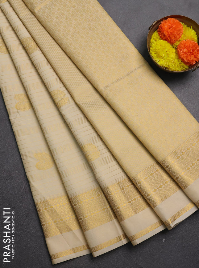 Semi kanchipuram silk saree cream with allover zari weaves & buttas and zari woven border
