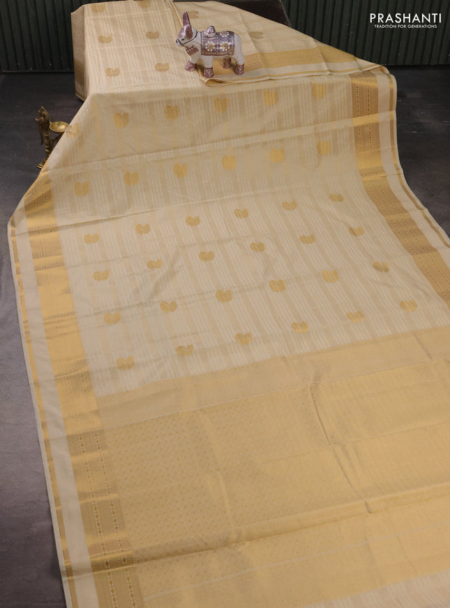 Semi kanchipuram silk saree cream with allover zari weaves & buttas and zari woven border
