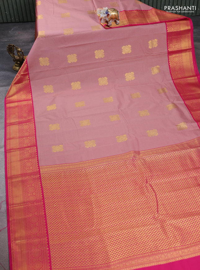 Semi kanchipuram silk saree pastel pink and pink with allover zari stripes & buttas and zari woven korvai border
