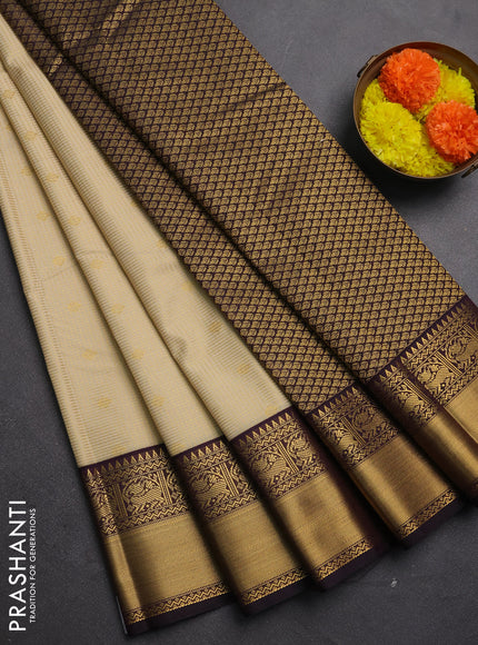 Semi kanchipuram silk saree cream and deep purple with allover small zari checks & buttas and zari woven border