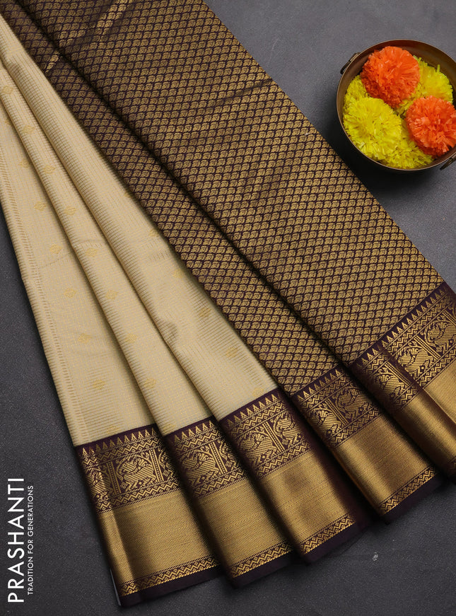 Semi kanchipuram silk saree cream and deep purple with allover small zari checks & buttas and zari woven border