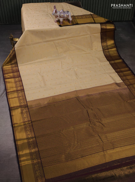 Semi kanchipuram silk saree cream and deep purple with allover small zari checks & buttas and zari woven border