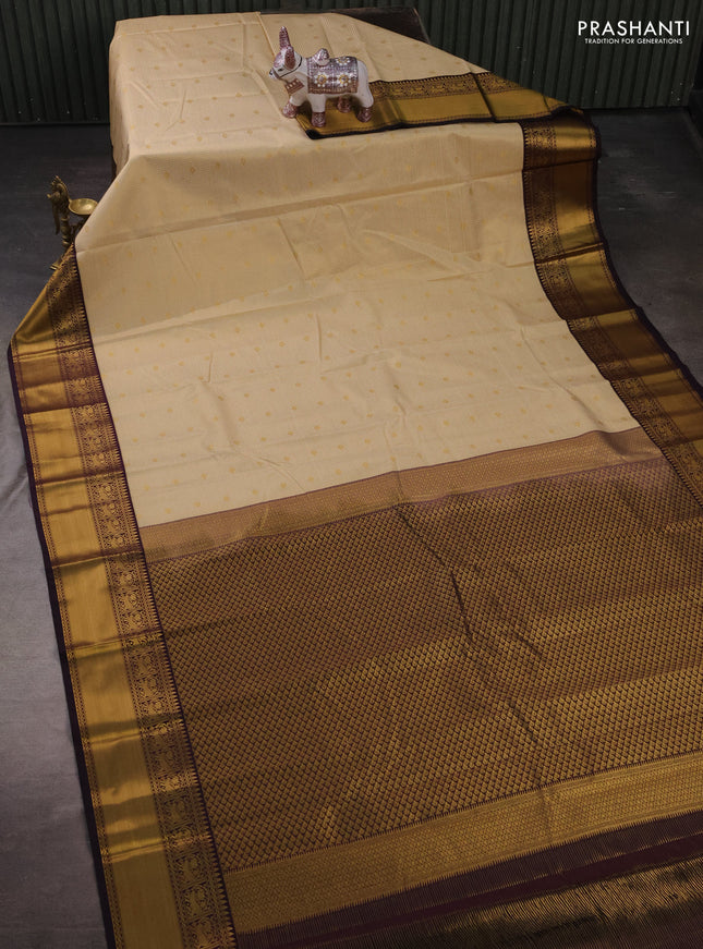 Semi kanchipuram silk saree cream and deep purple with allover small zari checks & buttas and zari woven border