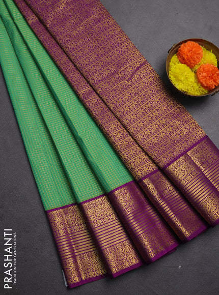 Semi kanchipuram silk saree light green and purple with allover small zari checks & buttas and zari woven border