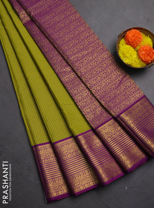 Semi kanchipuram silk saree mehendi green and purple with allover small zari checks & buttas and zari woven border