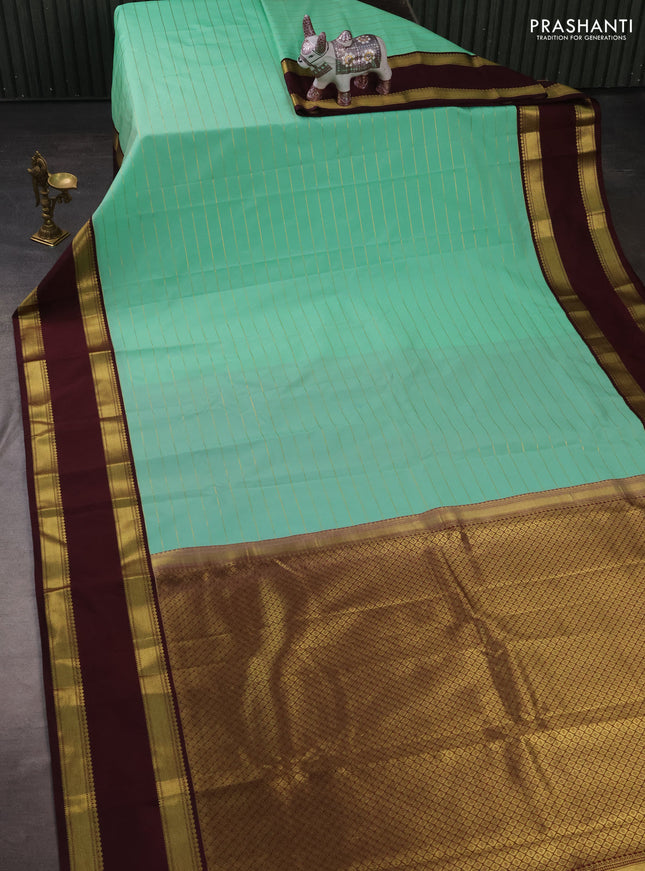 Semi kanchipuram silk saree teal green and deep maroon with allover zari weaves and rettapet zari woven korvai border