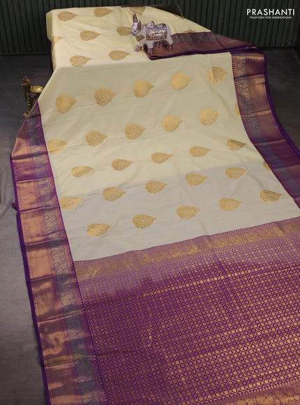 Semi kanchipuram silk saree off white and purple with zari woven buttas and zari woven korvai border