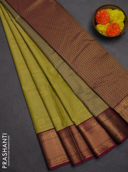Semi kanchipuram silk saree mehendi green and magenta pink with allover zari checks & buttas and temple design zari woven korvai border