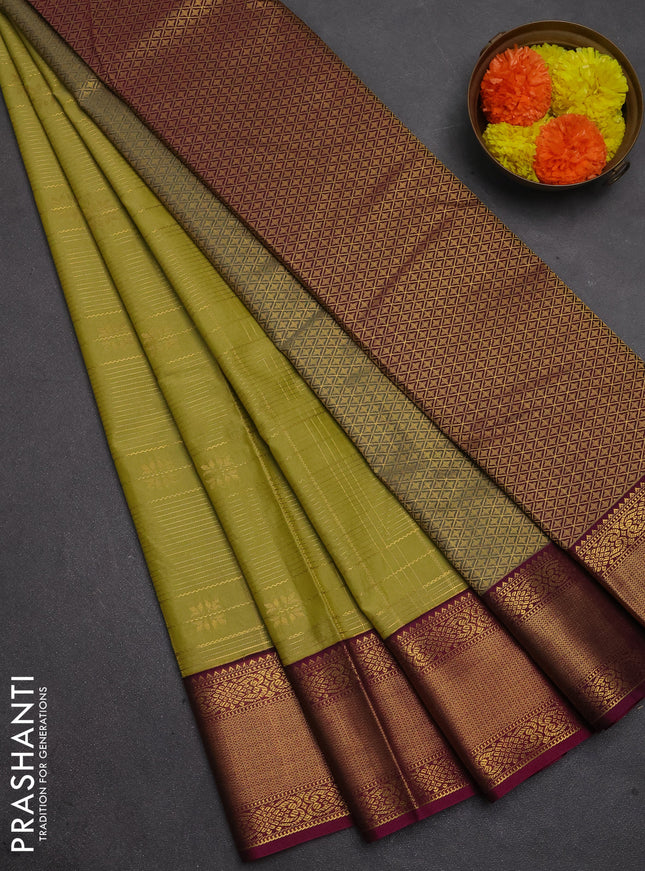 Semi kanchipuram silk saree mehendi green and magenta pink with allover zari checks & buttas and temple design zari woven korvai border