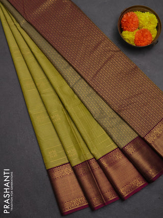 Semi kanchipuram silk saree mehendi green and magenta pink with allover zari checks & buttas and temple design zari woven korvai border