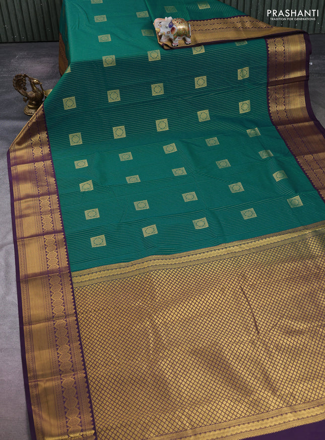 Semi kanchipuram silk saree green and deep purple with allover zari weaves & buttas and temple design zari woven border